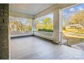 View of the spacious covered porch with brick columns and railings, perfect for relaxing at 137 Lancaster St, Chester, SC 29706