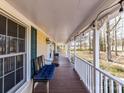 Long front porch with seating and string lights, perfect for relaxing at 2021 Witmore Rd, Wingate, NC 28174