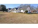 Exterior view featuring solar panels, brick, and spacious yard at 2297 Blossom Dr, Rock Hill, SC 29730