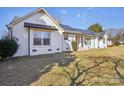 Charming white brick home with large windows and professionally landscaped yard at 2297 Blossom Dr, Rock Hill, SC 29730