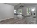 Spacious living room with large windows and vaulted ceilings, providing ample natural light at 313 Villa St, Kannapolis, NC 28083