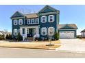 Attractive two-story home with white trim, shutters, well-maintained yard and a detached garage at 388 Luray Way, Rock Hill, SC 29730