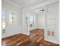 Elegant entryway featuring hardwood floors, glass doors, and ample natural light at 4030 Ambleside Dr, Fort Mill, SC 29707
