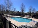 Community pool with a black fence at 5518 Prosperity View Dr, Charlotte, NC 28269