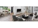 Open-concept living and dining area with stylish furnishings, hardwood floors, and lots of natural light at 1001 Kensington Ave, Gastonia, NC 28054