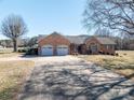 Expansive brick home with a long driveway leading to an attached two-car garage at 102 3Rd Se Ave, Catawba, NC 28609