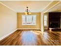 Bright dining room with hardwood floors, a large bay window, and an adjacent fireplace at 1146 Crestmont Se Dr, Concord, NC 28025