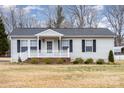 Charming single-story home with a white picket fence and well-maintained front yard at 11918 Crabapple Ln, Huntersville, NC 28078