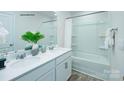 Bright bathroom with a double vanity, white cabinets, and a shower-tub combination at 1348 Secrest Commons Dr, Monroe, NC 28112