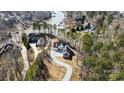 An aerial view of the property, showing the home’s location near the lake and surrounding trees at 154 Fox Hunt Dr, Mooresville, NC 28117