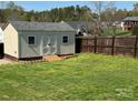Backyard shed with wooden ramp and secure double door storage at 1638 Marmot Pl, Concord, NC 28025