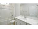 Well-lit bathroom features white vanity, a large mirror, and a shower-tub combo at 2058 Skyhawk Dr, Lake Wylie, SC 29745