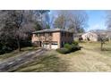 Spacious brick home with a two-car garage and a driveway leading to a well-maintained front yard at 2105 Monticello Dr, Gastonia, NC 28056