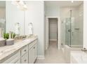 Bathroom featuring a double vanity, granite countertop, a glass enclosed shower, and tile flooring at 2150 Millennium Dr # 094, Lancaster, SC 29720