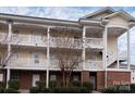Charming three-story condo featuring private balconies and well-maintained landscaping at 8668 Coralbell Ln # 10, Charlotte, NC 28213