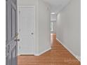Inviting foyer with hardwood floors leading to a bright, open living space at 9014 Arbor Creek Dr, Charlotte, NC 28269