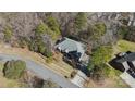 Aerial view of house surrounded by mature trees and long driveway at 10620 S Ford Rd, Charlotte, NC 28214