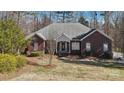 Charming brick home with well-maintained landscaping and a welcoming front entrance at 10620 S Ford Rd, Charlotte, NC 28214