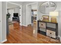 Bright foyer featuring hardwood floors, modern decor, and open doorways at 1427 Matthews Plantation Dr, Matthews, NC 28105
