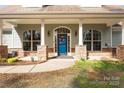 A welcoming front door framed by stone accents and large windows creates curb appeal at 1485 Sierra Rd, York, SC 29745