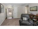 Welcoming entryway with view to the front door and neutral paint at 204 Edinburgh Ct, Mount Holly, NC 28120