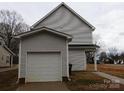Detached one-car garage with siding that matches the home at 260 Mills Ave, Troutman, NC 28166