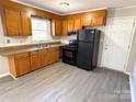 Functional kitchen with a black appliance package, durable countertops, and ample cabinet space at 3460 Hickory Pl, Salisbury, NC 28144