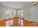 Bright living room with hardwood floors, large windows, and ample natural light at 604 Atherton Way, Rock Hill, SC 29730