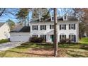 This beautiful home boasts a two-car garage, dormer windows, and manicured landscaping at 7201 Brassy Creek Ln, Charlotte, NC 28269