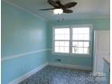 Dining area featuring large windows, blue walls and modern style flooring at 802 Lewis St, Gastonia, NC 28054