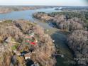 Aerial view of a lake community with tree coverage and lake access at 8749 Dog Leg Rd # 7, Sherrills Ford, NC 28673