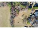 Expansive aerial view showcases the property's generous land with a mix of open fields and wooded areas at 1433 Buffalo Shoals Rd, Catawba, NC 28609