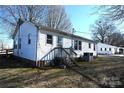 Rear view of the home featuring an elevated wooden deck and white siding at 1433 Buffalo Shoals Rd, Catawba, NC 28609