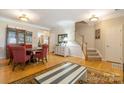 Inviting living area features hardwood floors, neutral walls, and a staircase to the upper level at 14622 Greenpoint Ln, Huntersville, NC 28078