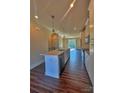 Spacious kitchen boasts stainless steel appliances, island with sink, and hardwood flooring at 2039 Clarksdale St # 32, Charlotte, NC 28206