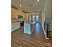 Modern kitchen features stainless steel appliances, center island and hardwood flooring at 2039 Clarksdale St # 32, Charlotte, NC 28206