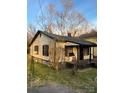 A compact home with a mix of classic siding and dark trim at 233 Poag St, Rock Hill, SC 29730