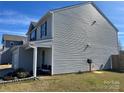 The side exterior of the house shows the vinyl siding and well-maintained lawn at 329 Aniston Ln, Shelby, NC 28152