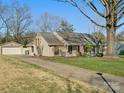 Well-maintained home with a brick exterior, detached garage, and a long driveway, set on a spacious lot at 4631 Dawnridge Dr, Charlotte, NC 28226
