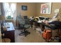 Cozy home office space with a large desk and multiple storage bins at 534 Fairbluff Ave, Salisbury, NC 28146