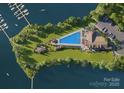 Aerial view of lakeside community with a swimming pool, marina, parking and green spaces at 7441 Fighting Creek Rd # 30, Sherrills Ford, NC 28673