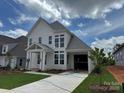 Charming two-story home with a covered entry, spacious driveway, and neatly landscaped yard at 7441 Fighting Creek Rd # 30, Sherrills Ford, NC 28673