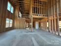 Unfinished interior showcasing exposed framing, high ceilings, and ample natural light at 7441 Fighting Creek Rd # 30, Sherrills Ford, NC 28673