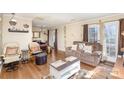 Cozy living room with hardwood floors and a relaxing seating arrangement at 1035 Nw Wexford Pl # D3, Concord, NC 28027