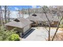 Beautiful brick home exterior with attached garage and a view of the lake at 11 Courageous St, Lake Wylie, SC 29710