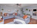 Spacious living room featuring hardwood floors, a sectional sofa, and stylish decor at 110 Weeping Willow Way, Gastonia, NC 28052