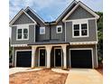 Charming gray two-story townhome features a covered entrance and black garage doors at 3627 Rogers St, Charlotte, NC 28208
