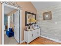 Inviting entryway featuring a white cabinet, decorative mirror, and elegant decor at 3757 Fieldhaven Ct, Maiden, NC 28650