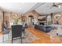 Open-concept living room featuring hardwood floors, a fireplace, and ample natural light at 3757 Fieldhaven Ct, Maiden, NC 28650