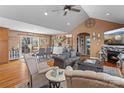 Spacious living room featuring hardwood floors, a stone fireplace, and stylish furnishings at 3757 Fieldhaven Ct, Maiden, NC 28650